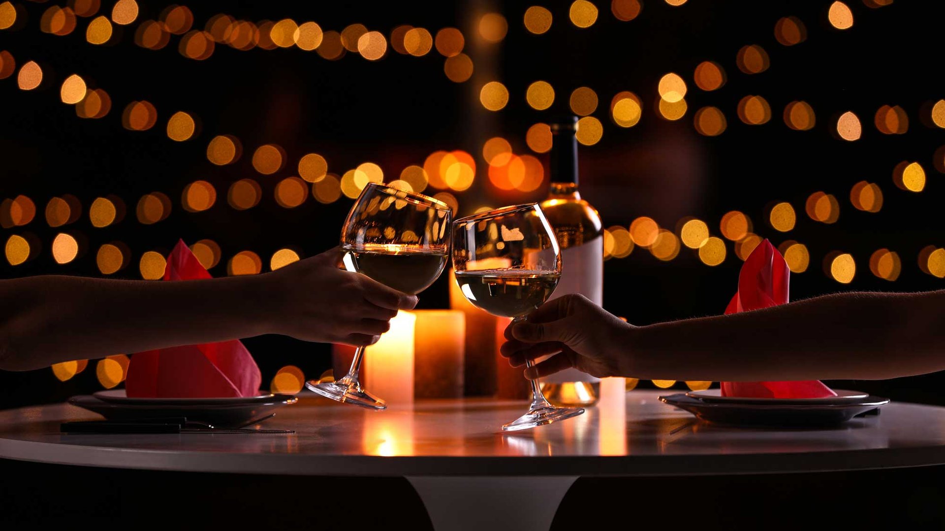 Couple toasting at an anniversary dinner